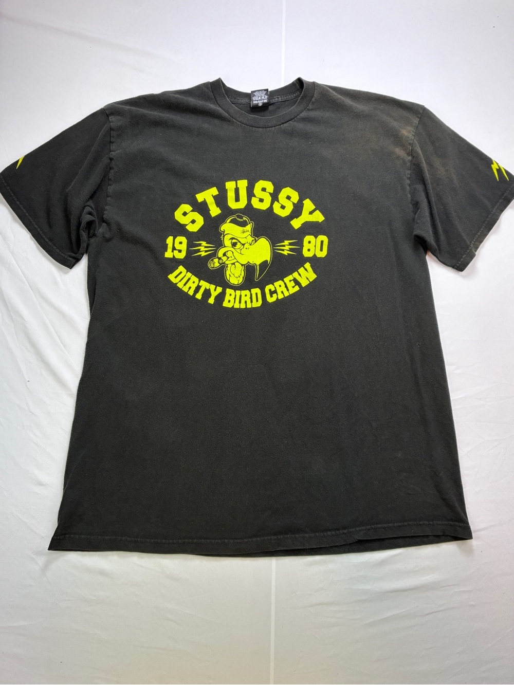 Stussy Black Tee with Neon Yellow Dirty Bird Crew Graphic
